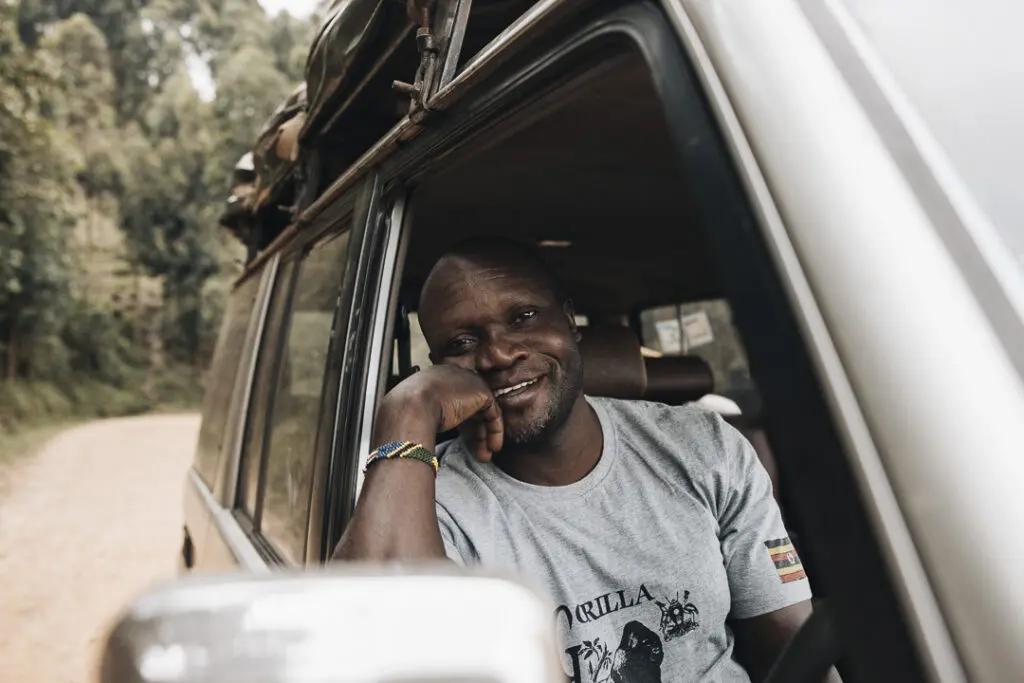 Our driver Godfrey in one of our cars