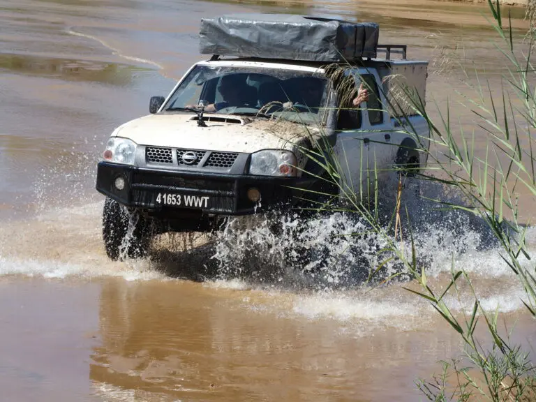 Road To Manja Waterpool Crossing Nissan double cab from roadtrip africa
